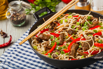 Chinese pasta with beef. Prepared in wok.