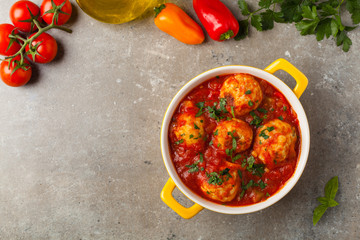 Chicken meatballs with tomato sauce. Served with rice.