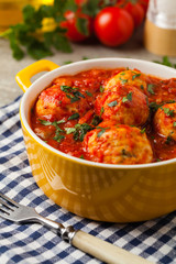 Chicken meatballs with tomato sauce. Served with rice.
