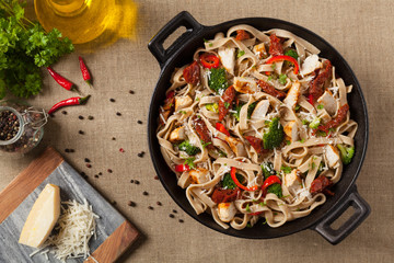 Whole-grain tagliatelle pasta with grilled chicken.