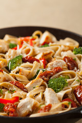Whole-grain tagliatelle pasta with grilled chicken.