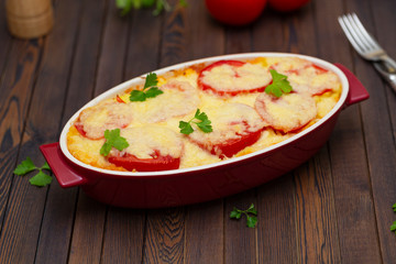 Potato casserole with meat, tomatoes and cheese