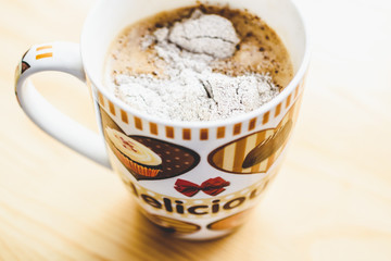 Сup of coffee on a wooden table