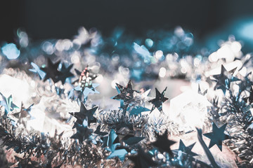 Tinsel with stars of silver color close-up