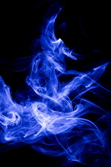 Blue smoke on black background