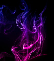 Colored smoke on black background