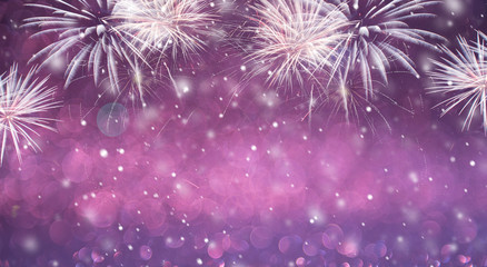 Purple fireworks and bokeh in New Year eve and copy space. Abstract background holiday.