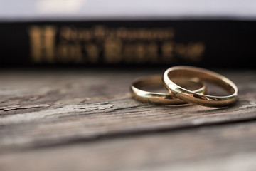 the bible is the base where upon two wedding rings rest