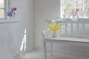 beautiful spring flowers in white vintage interior