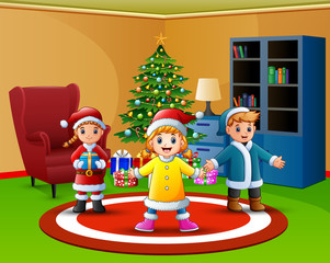 Obraz na płótnie Canvas Cartoon of Happy kids in the living room with christmas tree