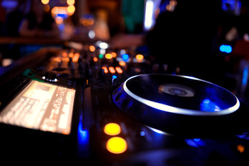 Fototapeta na wymiar DJ playing music on light background