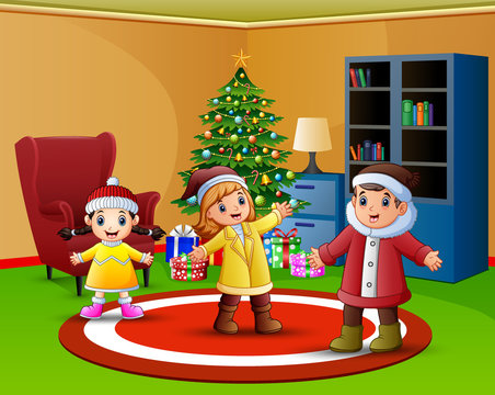 Cartoon of Happy kids in the living room with christmas tree