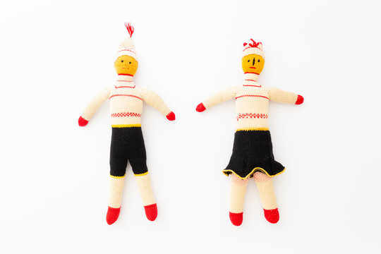 Top view of a male and a female handmade doll on white background representing togetherness