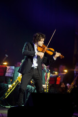 Fototapeta premium Musician violinist with a violin in his hands.