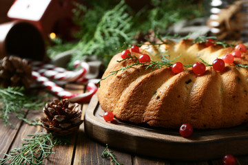 Fototapeta na wymiar Delicious Christmas cake on wooden table