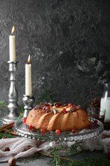 Delicious Christmas cake on grey table