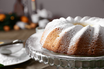 Delicious Christmas cake on glass stand, closeup