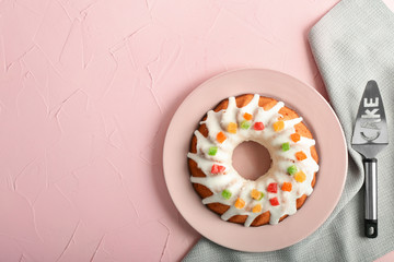 Plate with delicious Christmas cake on color table