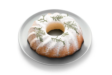 Plate with delicious Christmas cake on white background