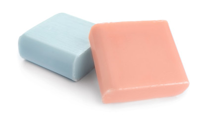 Different soap bars on white background