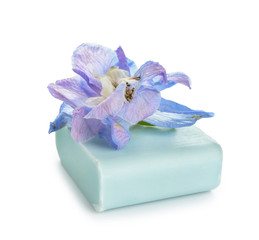 Soap bar with flower on white background