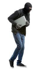 Male thief with laptop on white background