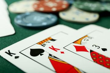 Cards for poker game on table, closeup