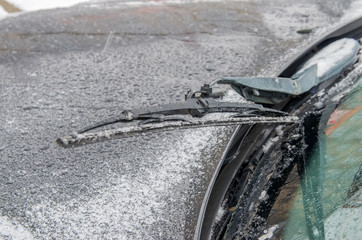 Car wipers covered with ice. Close-up