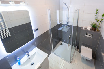 New bathroom interior with illuminated mirror