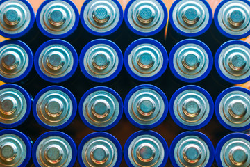 Closeup of pile of used alkaline batteries. Close up colorful rows of selection of AA batteries...