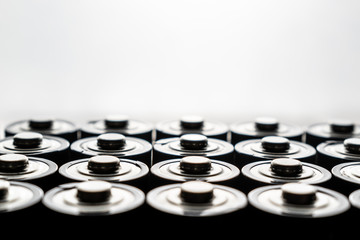 Closeup of pile of used alkaline batteries. Close up colorful rows of selection of AA batteries...