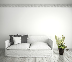 Helles Sofa mit Zimmerpflanze vor weißer Wand