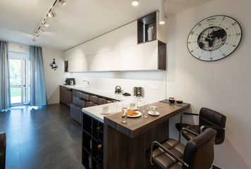 Interior of modern kitchen with built-in appliances