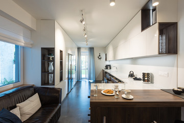 Interior of modern kitchen with built-in appliances