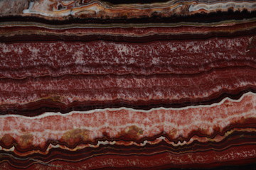 Natural red color Onyx stone with dark and light streaks and a beautiful pattern