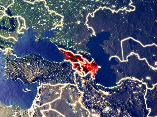 Caucasus region from space on Earth at night. Very fine detail of the plastic planet surface with bright city lights.