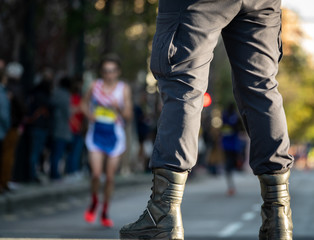 Security member guard and street with runners