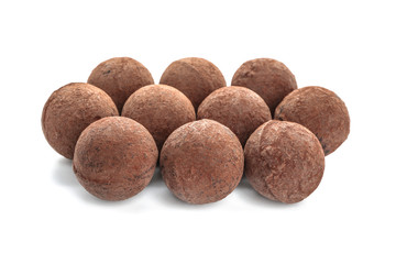 Tasty chocolate truffles on white background