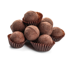 Tasty chocolate truffles on white background