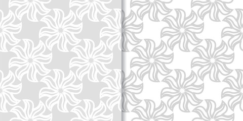 Light gray floral backgrounds. Set of seamless patterns