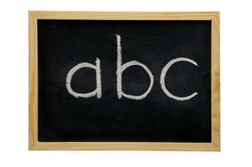 Fototapeta premium WOODEN FRAMED BLACK BOARD WITH THE LETTERS A B C WRITTEN WITH WHITE CHALK