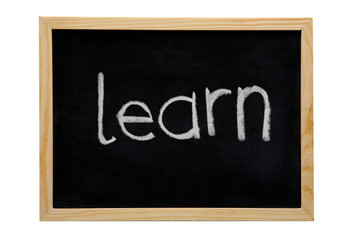 WOODEN FRAMED BLACK BOARD WITH THE WORD LEARN WRITTEN WITH WHITE CHALK