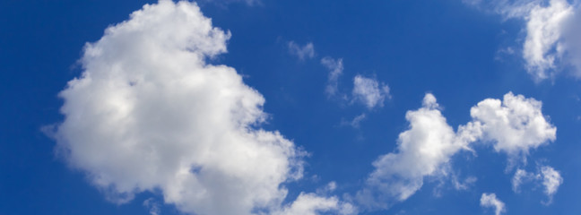 Naklejka na ściany i meble blur white clouds against a blue sky