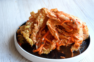 Korean kimchi sidedish on neutral background.