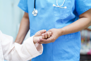 Holding Touching hands Asian senior or elderly old lady woman patient with love, care, helping,...