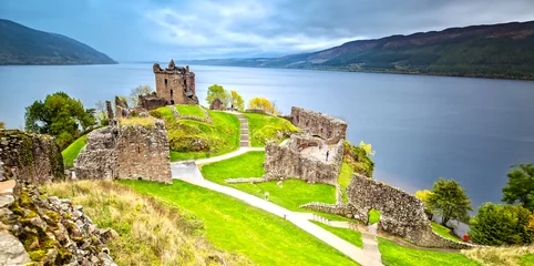 Fotobehang Urquhart Castle with Dark Cloud Sky and Loch Ness in the Background © susanne2688