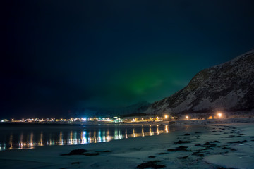 Lights of the Village are Reflected in the Night Fjord
