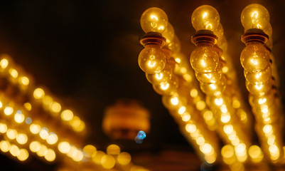 Old bulb with bokehs in festival. Background.