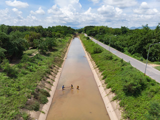 Asian fisherman catching fish