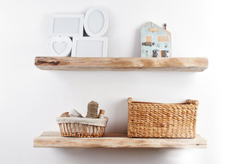Wooden shelves with decor items. Home interior